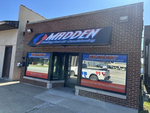 An image of the Madden storefront with window graphics and awning.